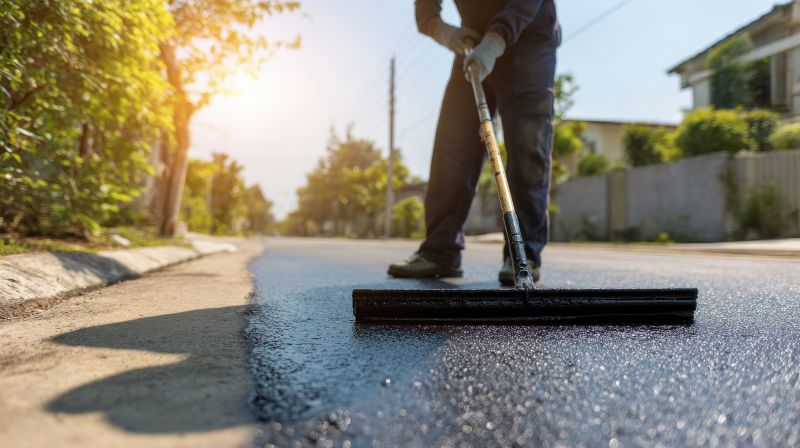 Local Asphalt Driveway Sealcoating pros at work